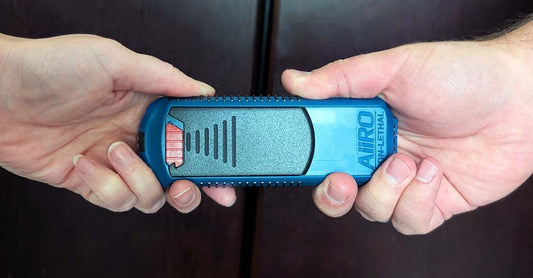 A close up of an AIIRO® being passed from one hand to another.