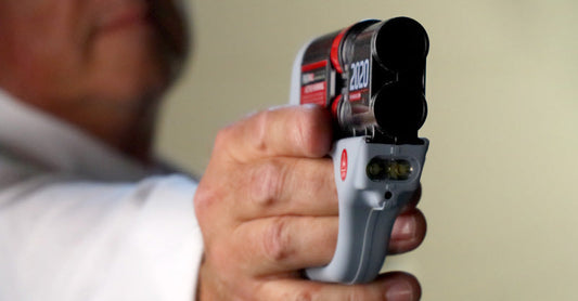 A Man Holds Up his HERO® 2020, Prepared to Fire