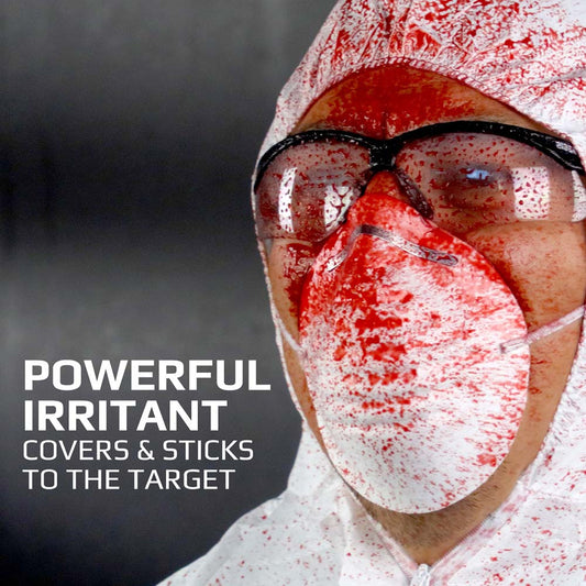A man wearing protective gear over his head, covered in red irritant gel. Text on the image read: Powerful irritant covers and sticks to the target.